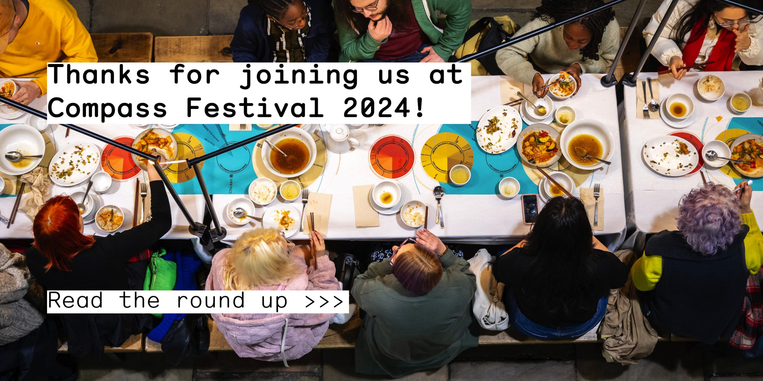 People sat sharing food at a large table. Text reads 'thanks for joining us at Compass Festival 2024! Read the round up >>>'